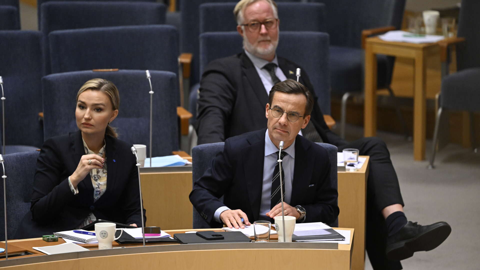 Energi- och näringsminister Ebba Busch (KD), arbetsmarknads- och integrationsminister Johan Pehrson (L) och statsminister Ulf Kristersson (M) under onsdagens partiledardebatt i riksdagen.