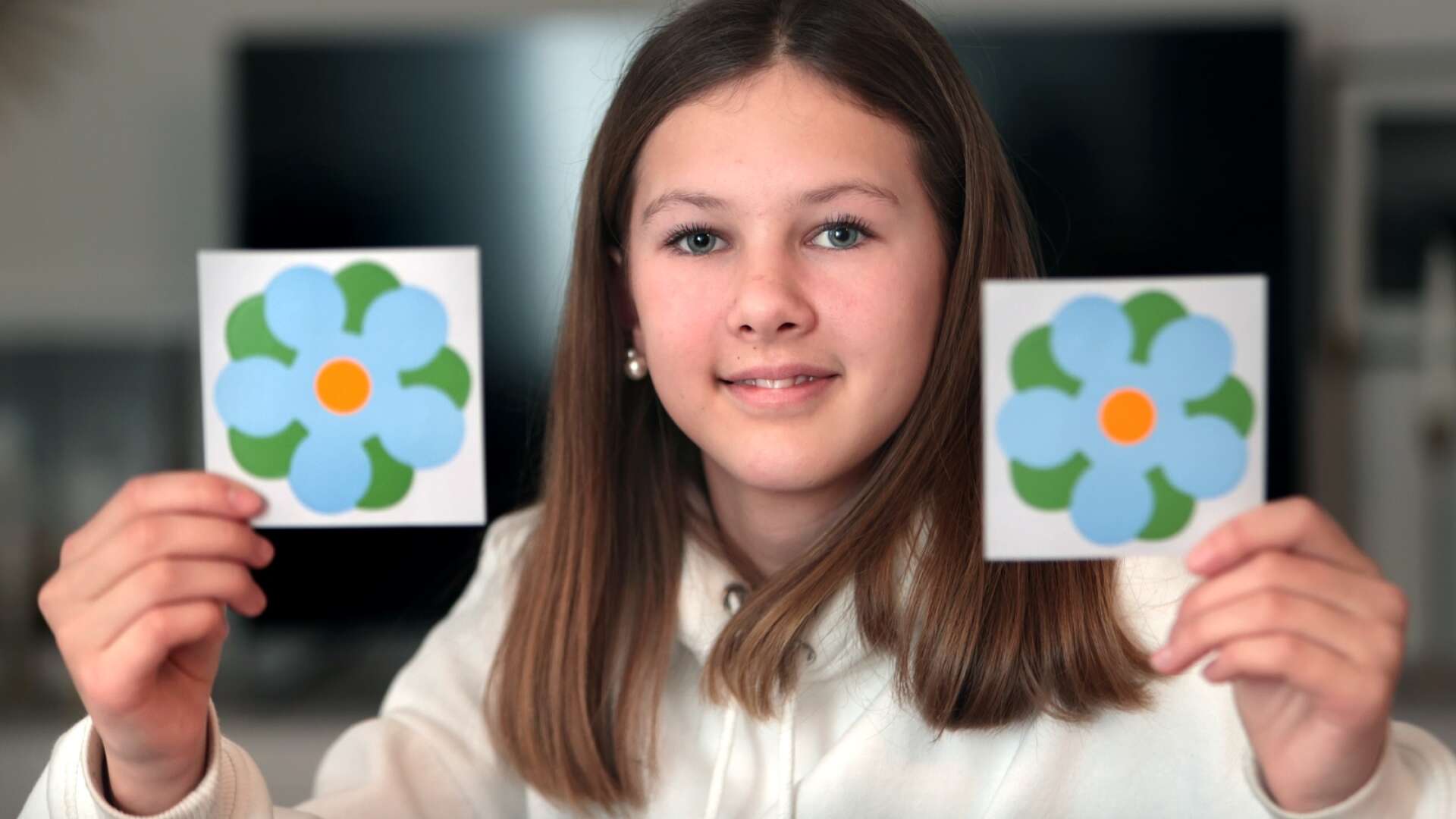 Elsa Schymberg, 12 år, från Karlstad har designat årets majblomma som hon döpt till fred på jorden.